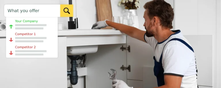 Plumber repairing plumbing under a kitchen sink